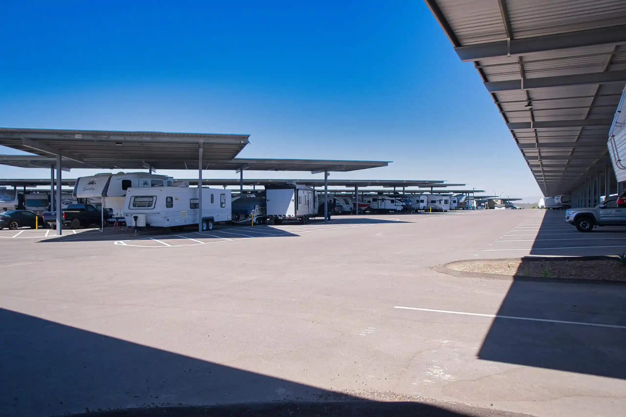 Honey Bee RV in Peoria parking with awning