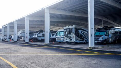 Row of covered RV parking at Honey Bee RV Storage in Fort Myers.