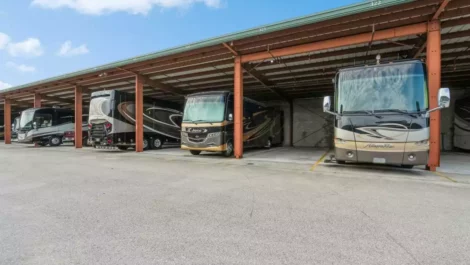 RVs parked in covered parking spaces.