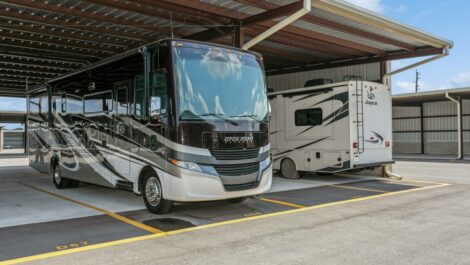 RVs parked in covered parking space.