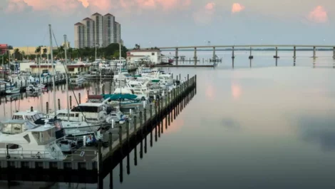 iew of boat dock and highway bridge in downtown Fort Myers, Florida.