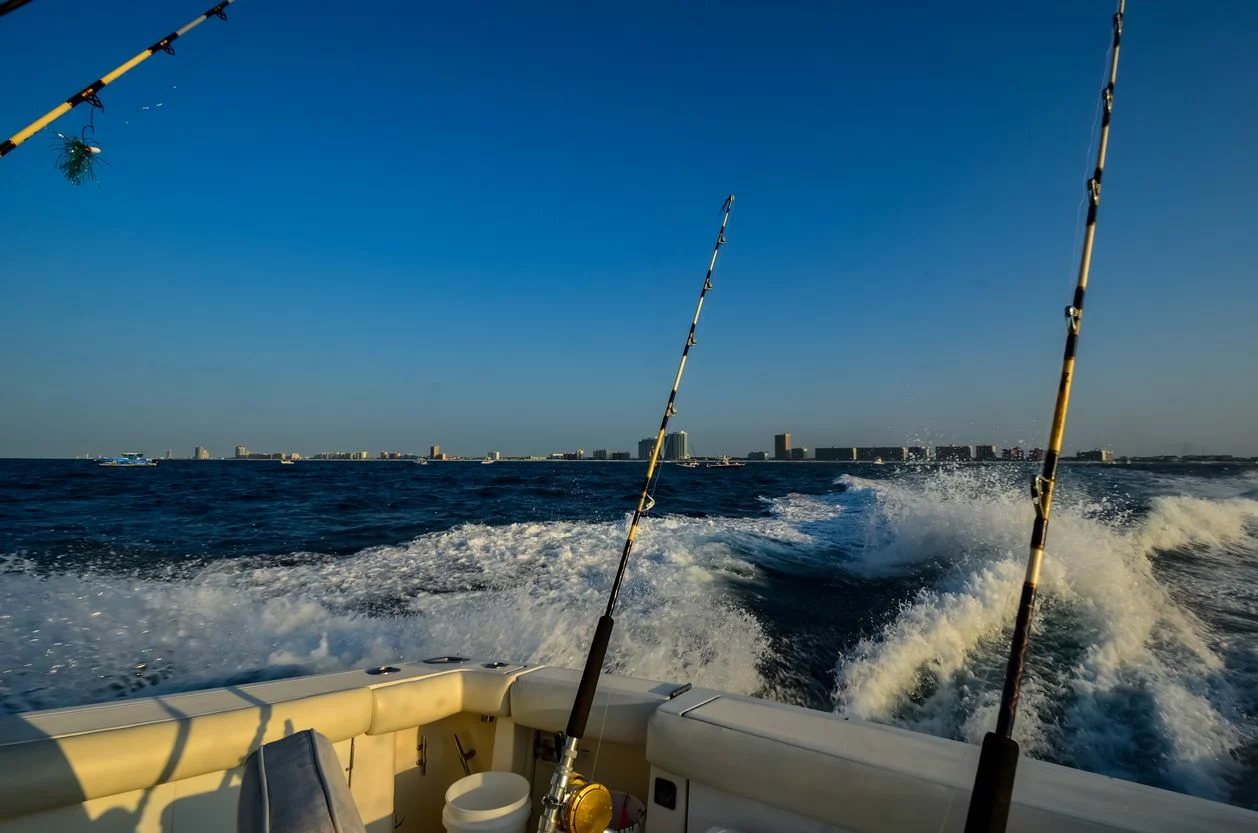 Fishing poles set on boat in Gulf of Mexico waters near Florida. 