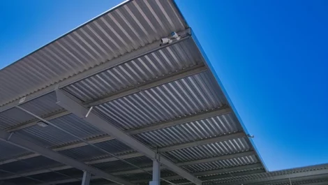 Covered parking spaces with security cameras.