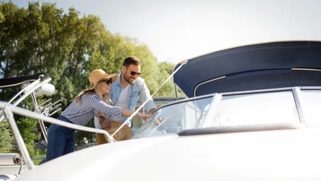 A couple inspecting their boat together.