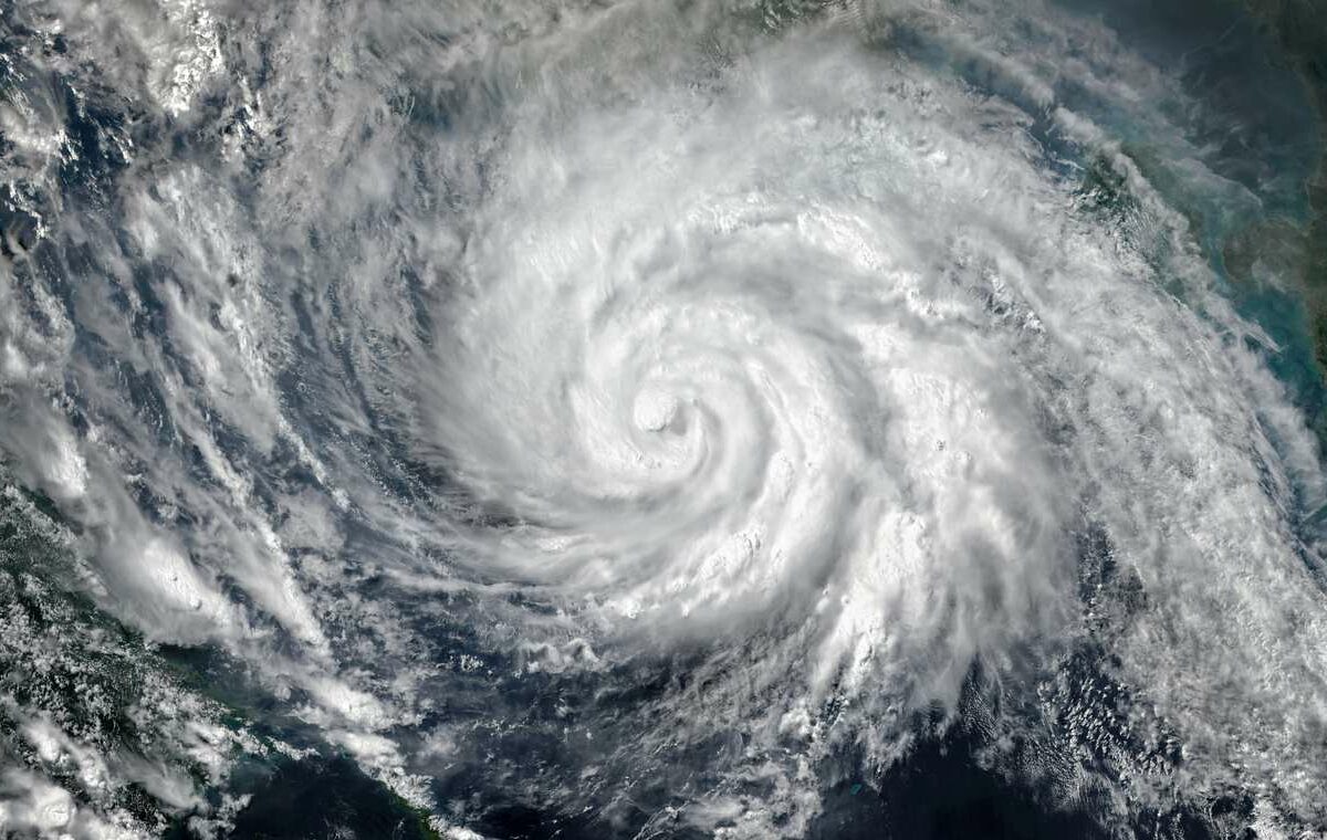 A satellite picture of a hurricane in the middle of the ocean.