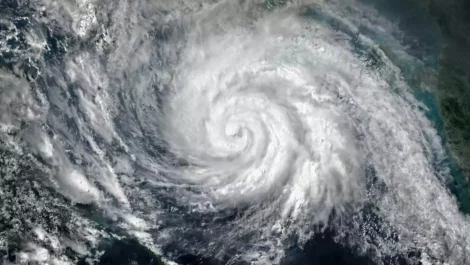 A satellite picture of a hurricane in the middle of the ocean.