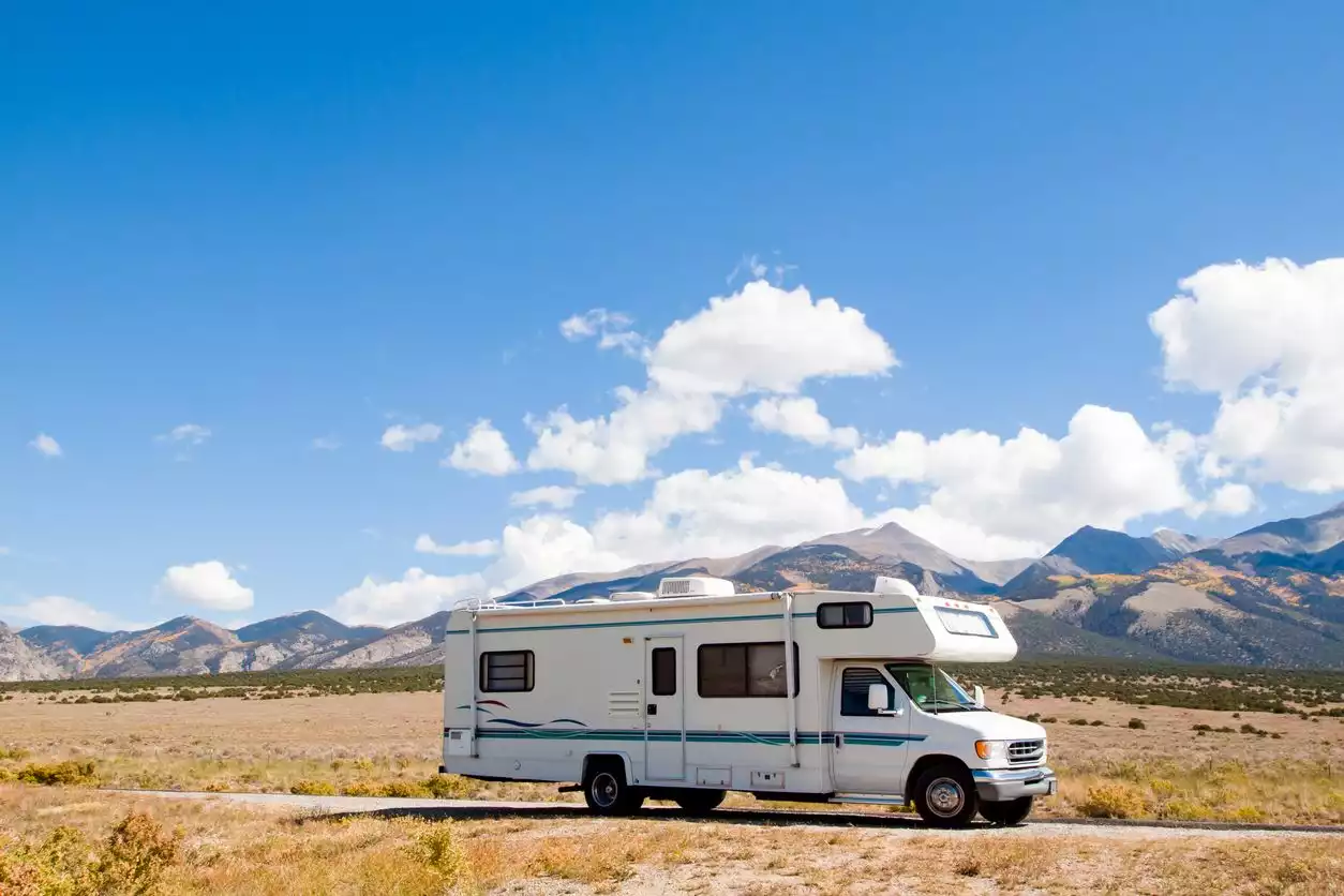 A motor home driving near the Great Sand Dunes in Colorado. 